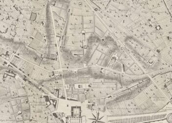 Detailed black-and-white map of a European city with labeled landmarks, streets, buildings, green spaces, and compass rose.